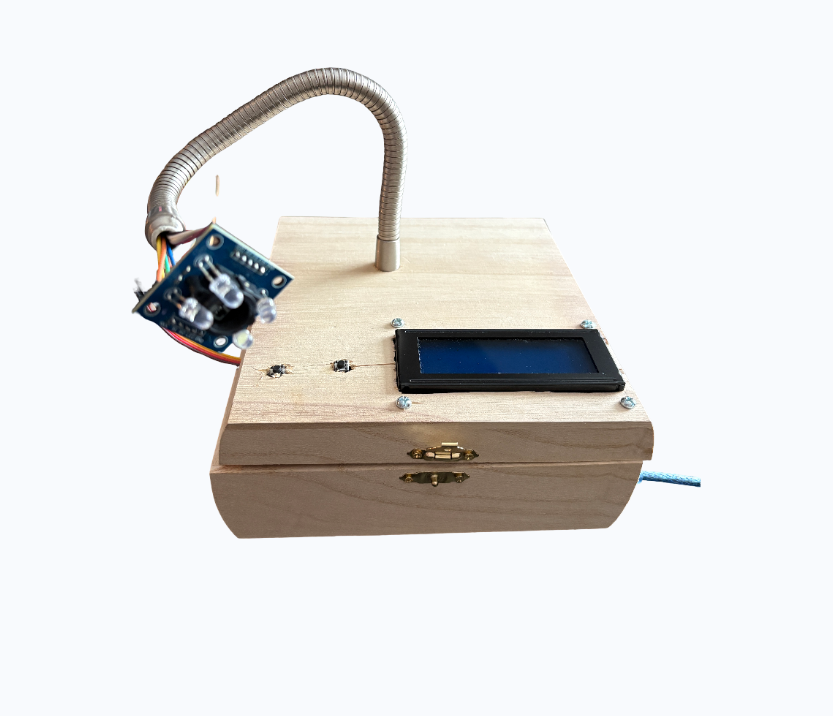 Custom designed RPM detector with flexible gooseneck, calibration and start buttons, and LCD display for live RPM and time drift readings.